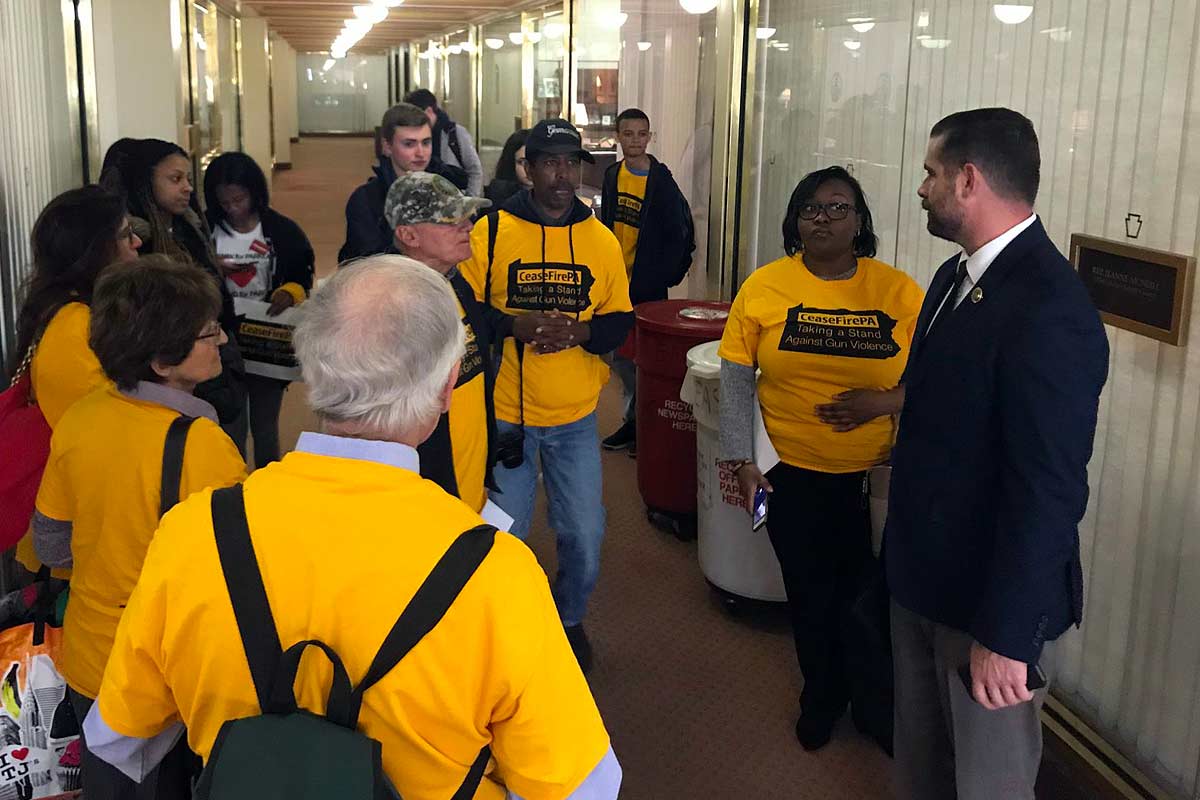 3c-hallwaygroup group in hallway listening to elected official
