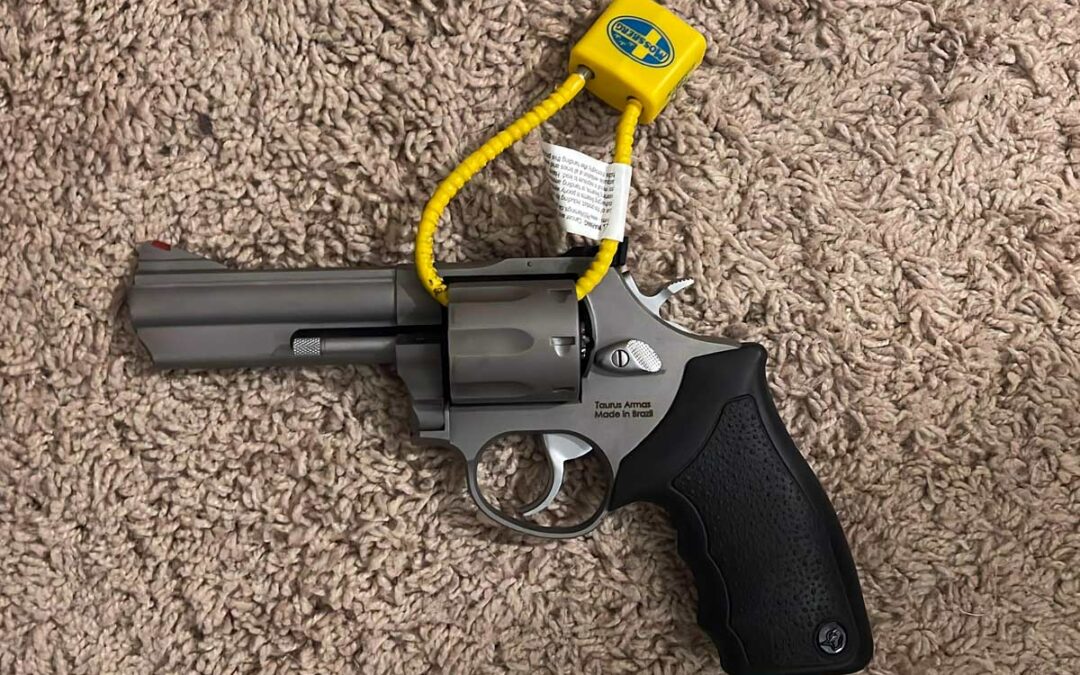 pistol secured by cable lock