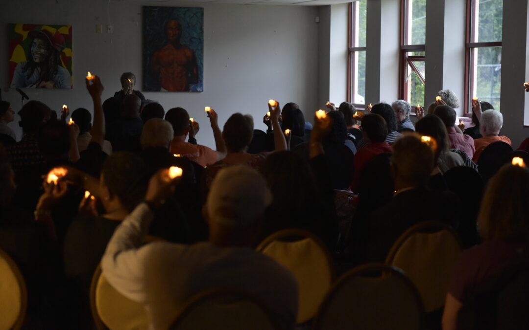 Gun violence prevention vigil, lifted candles